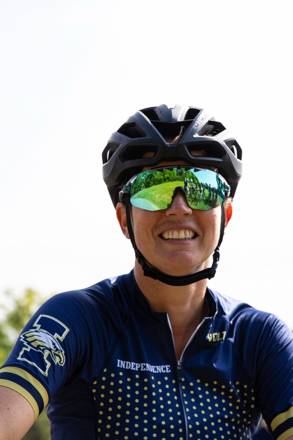 Smiling coach in helmet and Independence jersey