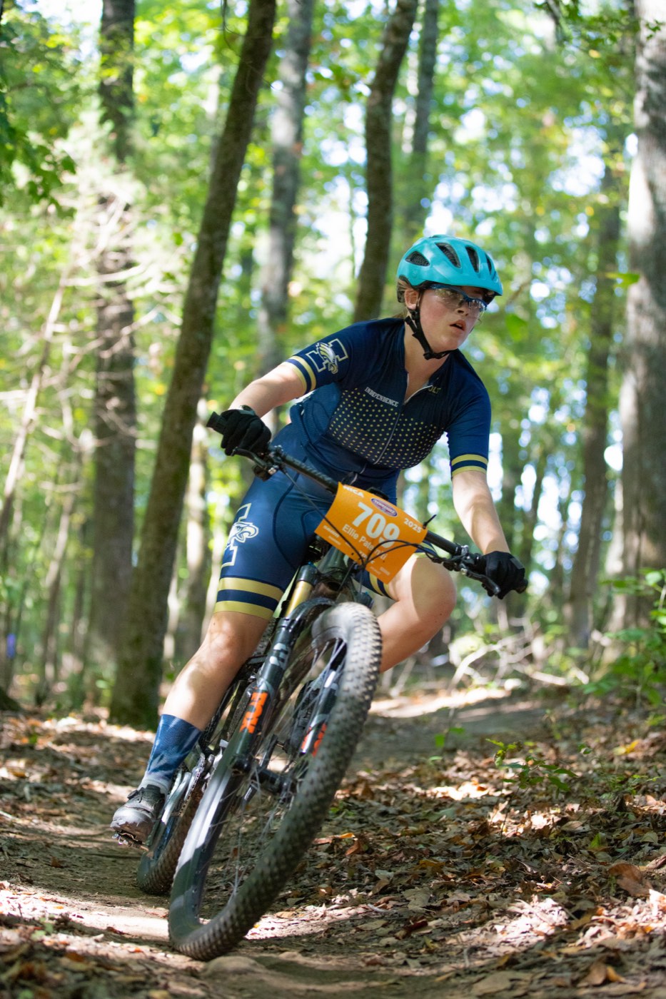 Racer carving through the woods in Independence kit